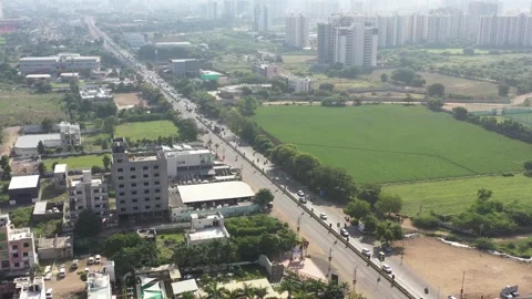Aerial drone camera shot moving towards the side where many vehicles are visible 動画素材 259557752