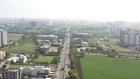 Aerial drone camera shot moving towards the side where many vehicles are visible 動画素材 259557773