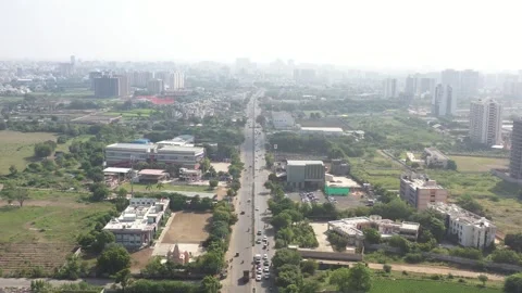 Aerial drone camera shot moving towards the side where many vehicles are visible 動画素材 259557777