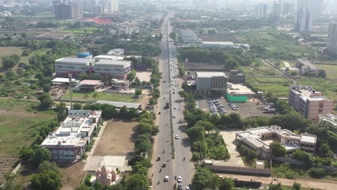 Aerial drone camera shot moving towards the side where many vehicles are visible 動画素材 259557790