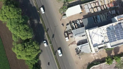 Aerial drone camera shot moving towards the side where many vehicles are visible 動画素材 259557811