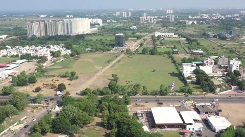 Aerial drone camera shot moving towards the side where many vehicles are visible 動画素材 259557834