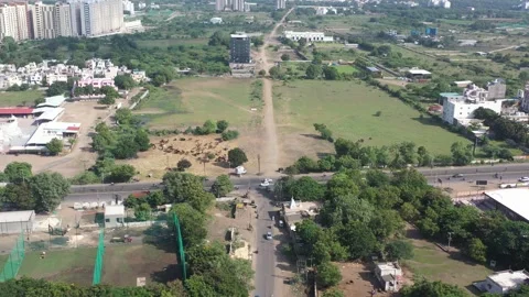 Aerial drone camera shot moving towards the side where many vehicles are visible 動画素材 259557858