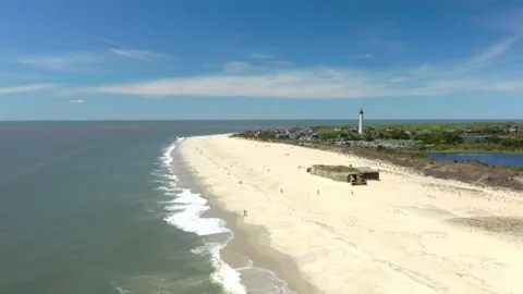 Aerial Drone of Cape May Point Lighthouse New Jersey Blue Skies Summer 库存影片 141087456