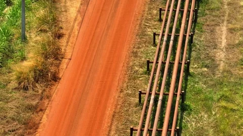 Aerial drone capture of an extensive crude oil pipeline system. Video stock 332468632