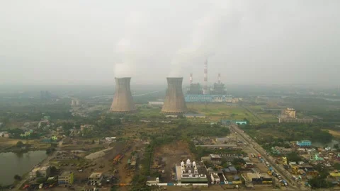 Aerial drone capture of factories in India, focusing on dense smoke rising from Stock Footage 299222453