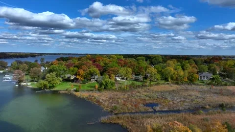 Aerial drone captures stunning fall colors at Orchard and Cass Lakes in Michigan Video stock 220035234