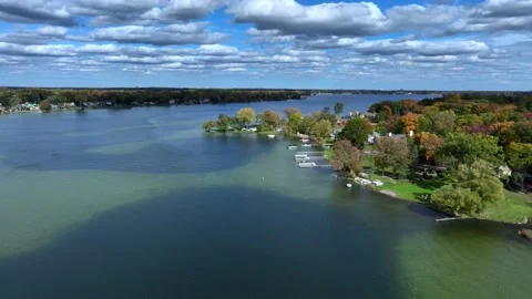 Aerial drone captures stunning fall colors at Orchard and Cass Lakes in Michigan Video stock 220035236