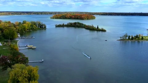 Aerial drone captures stunning fall colors at Orchard and Cass Lakes in Michigan Video stock 220035264