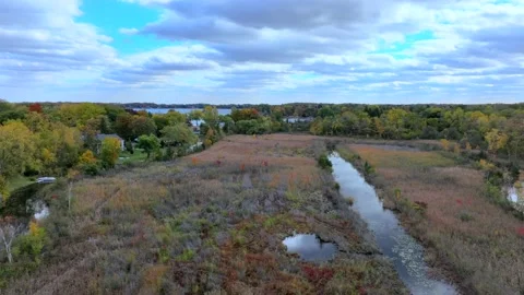 Aerial drone captures stunning fall colors at Orchard and Cass Lakes in Michigan Video stock 220035311