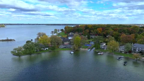 Aerial drone captures stunning fall colors at Orchard and Cass Lakes in Michigan Video stock 220035318