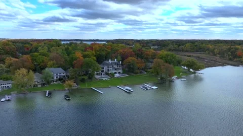 Aerial drone captures stunning fall colors at Orchard and Cass Lakes in Michigan Video stock 220035319