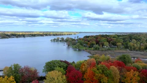 Aerial drone captures stunning fall colors at Orchard and Cass Lakes in Michigan Video stock 220035322