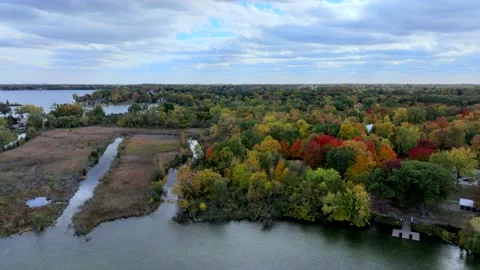 Aerial drone captures stunning fall colors at Orchard and Cass Lakes in Michigan Video stock 220035327