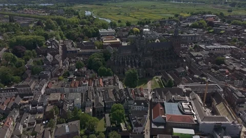 Aerial Drone Cinematic Pullback Reveal of Gothic European Cathedral and City Stock Footage 308821895