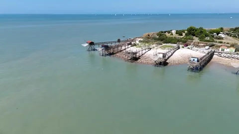 Aerial Drone circular movement shot showing traditional fishing huts on stilts Video stock 316070592