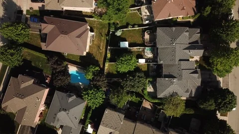 Aerial drone clip, top down, low altitude, of a suburb in summer. Stock Footage 90467192