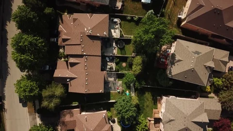 Aerial drone clip, top down, low altitude, of a suburb in summer. Stock Footage 90467318