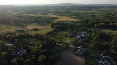 Aerial drone clip of two mobile/cell phone signal masts suburbian area Stock Footage 245633965