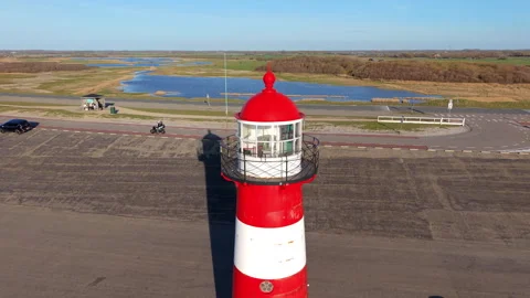 An aerial drone close-up of the red lantern room and balcony of the Westkapelle Видео 336214480