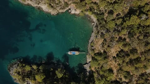 Aerial drone close up view to clear blue sea water with moored boats and yachts Stock Footage 176847200