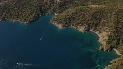 Aerial drone close up view to clear blue sea water with moored boats and yachts Stock Footage 176847558