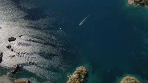 Aerial drone close up view to clear blue sea water with moored boats and yachts Stock Footage 178979382