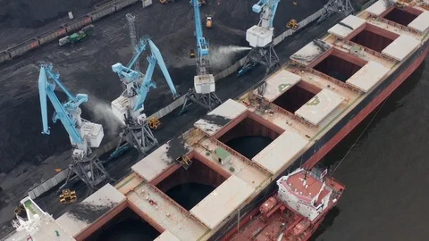 Aerial drone close up view of coal transshipment to cargo ship. Loading Video stock 118188050