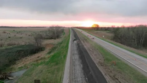 Aerial Drone Construction Road Work Iowa Breaking Asphalt Concrete Tractor Stock Footage 238578559