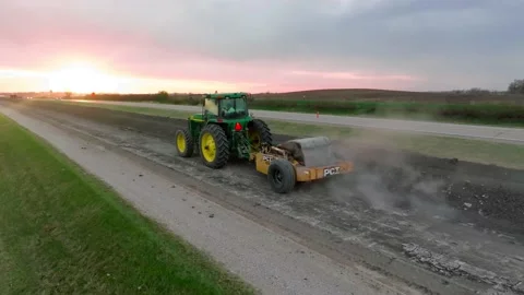 Aerial Drone Construction Road Work Iowa Breaking Asphalt Concrete Tractor Stock Footage 238578560