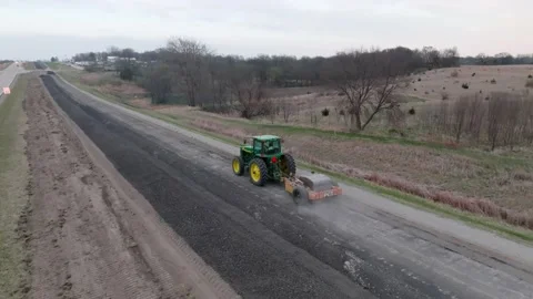 Aerial Drone Construction Road Work Iowa Breaking Asphalt Concrete Tractor Stock Footage 238578561