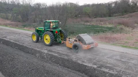 Aerial Drone Construction Road Work Iowa Breaking Asphalt Concrete Tractor Stock Footage 238578562