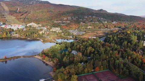 Aerial Drone Curved Forward Flight Along Lakeshore Toward Mont-Tremblant  Autumn Stock Footage 321379019