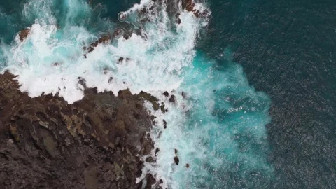 Aerial Drone Descending Toward Waves on Volcanic Lava Coast, Tenerife Stock Footage 336280168