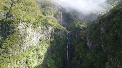 Aerial Drone Descent Along Risco Waterfall Cliff Stock Footage 320733612