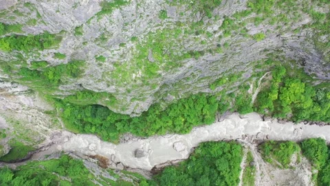 Aerial drone descent into the deep and rugged Cherek Gorge Stock Footage 338014772