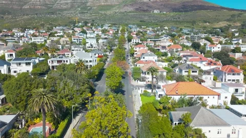 Aerial Drone Descent from Table Mountain Over Cape Town Suburban Neighborhood Stock Footage 344030027