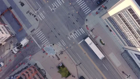 Aerial Drone Descent Upon Intersection in Downtown City With Bus and Traffic Stock Footage 141383813