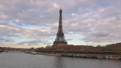Aerial drone distant sunset view of Tour Eiffel Tower and Seine River bridge Stock Footage 237382581