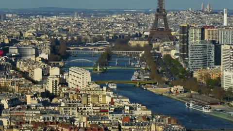 Aerial drone distant sunset view of Tour Eiffel Tower and Seine River bridges Stock Footage 239199800