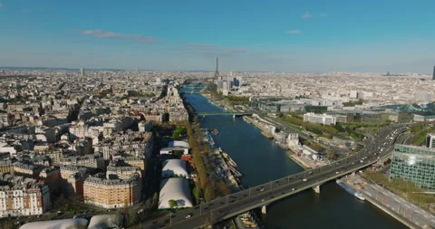 Aerial drone distant sunset view of Tour Eiffel Tower and Seine River bridges Stock-Footage 239245734