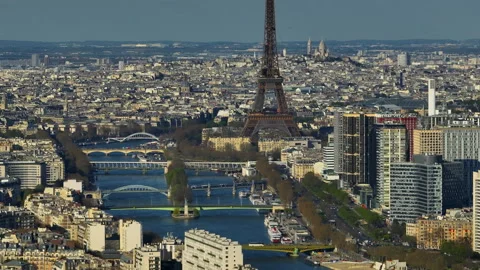 Aerial drone distant sunset view of Tour Eiffel Tower and Seine River bridge Stock Footage 240503541