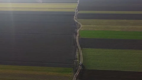 Aerial Drone Distant View Shot Tractor On A Rural Road Stockbeeldmateriaal 154559367