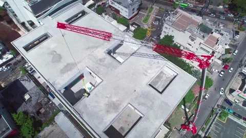 Aerial Drone Dolly Back from Skyscraper Rooftop Construction Crane Stock Footage 342057640