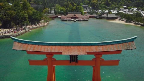 Aerial Drone dramatically flying away from Itsukushima Shrine at Miyajima, Видео 93017692