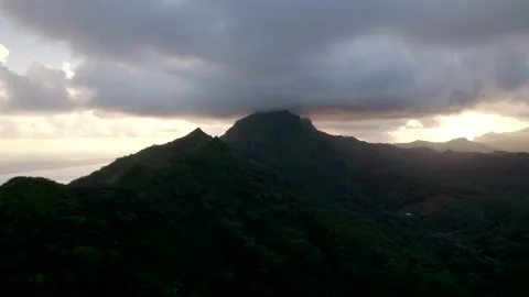 Aerial Drone during Cloudy Sunset revealing Cloudscape and Raiatea 10Bit Stock Footage 171605845