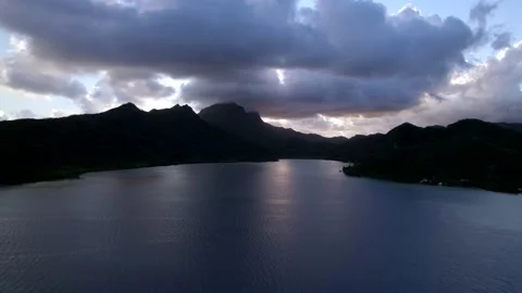 Aerial Drone during Sunset over Bay with Silhouettes of Raiatea 10Bit Stock Footage 171606982