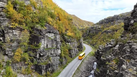 Aerial drone E45 highway with yellow Finnmark bus and car traffic Vidéo 332893090
