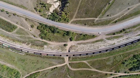 Aerial drone empty freight train turns in a circle Stock Footage 98044140