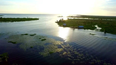 Aerial drone epic fly over fishing camp in Wetland marsh swamp wilderness Stock Footage 72936800
